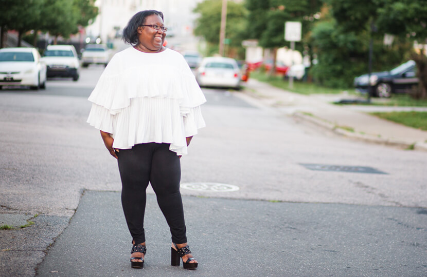 plus-size style evolution white flowy top black pants street style