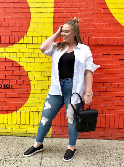 Ashby in a casual outfit featuring a white button-down.