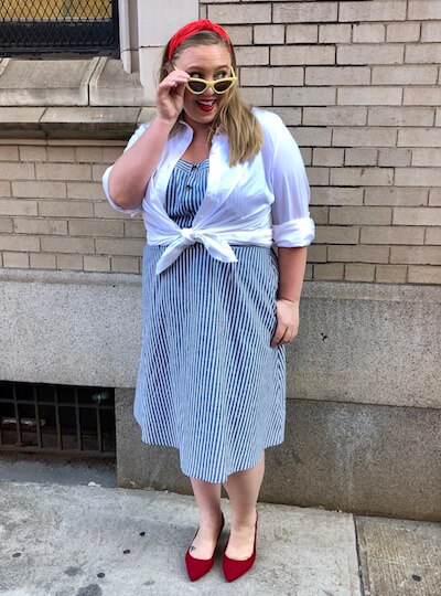 Ashby in a retro outfit featuring a white button-down.