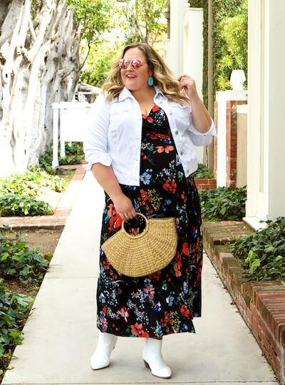 Reah Norman in floral maxi dress and white denim jacket.