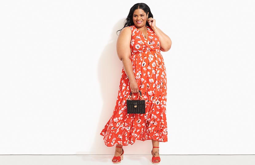 plus size model in red floral maxi dress