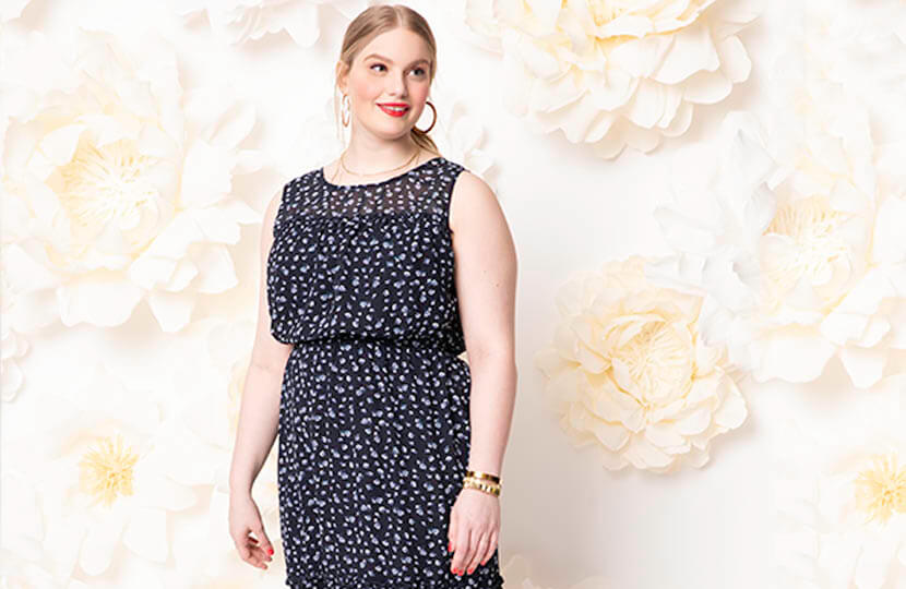 Plus size model in dotted maxi dress.