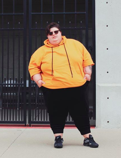 plus size lgbtq influencers j aprileo yellow hoodie black pants