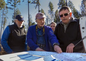 John Bergenske, CEO of Wildsight, Juri Peepre, a Wildsight director, and Paul Frasca, RPF, go over a cut block map with Ken Streloff, RFT on a Forestry Field Trip with Canfor, to Horsethief drainage.