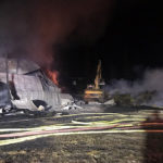 Fire departments battle large overnight structure fire
