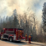 Fairmont FD battling grass fire near resort