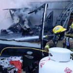 Dogs alert family to early morning structure fire