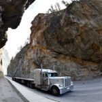 Mandatory devices to limit speed for commercial trucks