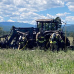 Quick action by Jaffray Firefighters extinguishes tractor fire