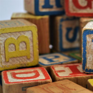 wooden toy blocks stacked on one another