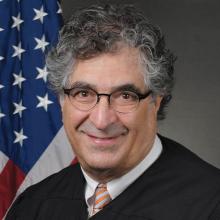 Hon. Bruce A. Harwood 