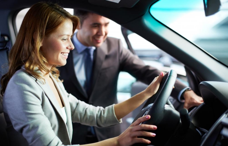 rebates and incentives - woman sitting in car