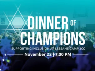 A large crowd sits at decorated tables under blue lighting for the "Dinner of Champions" event, held November 22 at 7:00 PM in support of inclusion at Lessans Camp JCC.
