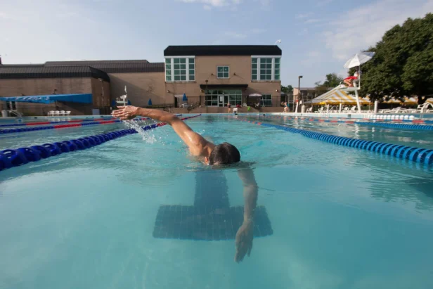 A man swimming in a pool.
