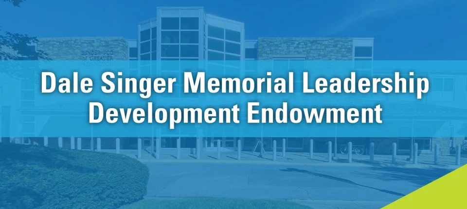 Text reads "Dale Singer Memorial Leadership Development Endowment" over a blue-tinted image of a modern building exterior.