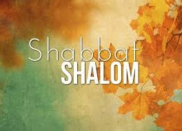 Text "Shabbat Shalom" is overlaid on a background with green, yellow, and orange hues and autumn leaves on the right side.