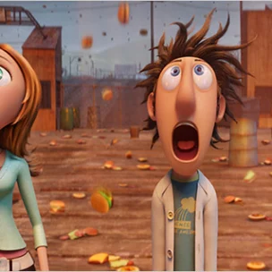 Two animated characters stand on a dock, looking up in surprise as hamburgers fall from the sky; a small monkey sits nearby.