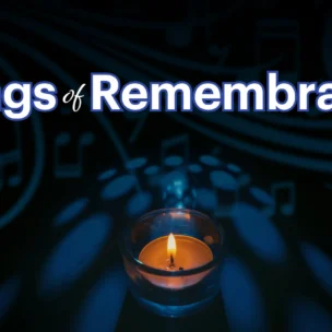 A lit candle sits beneath the words “Songs of Remembrance” with music notes and symbols in the dark background.