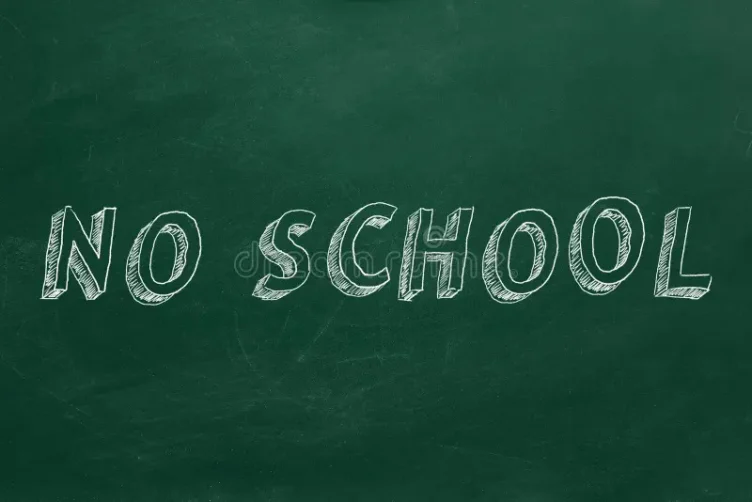 The words “NO SCHOOL” are written in large, white chalk letters on a green chalkboard.