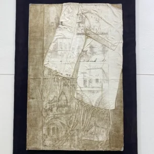 Mixed-media collage featuring layered paper with architectural sketches and hanging fabric threads on a dark rectangular backing.