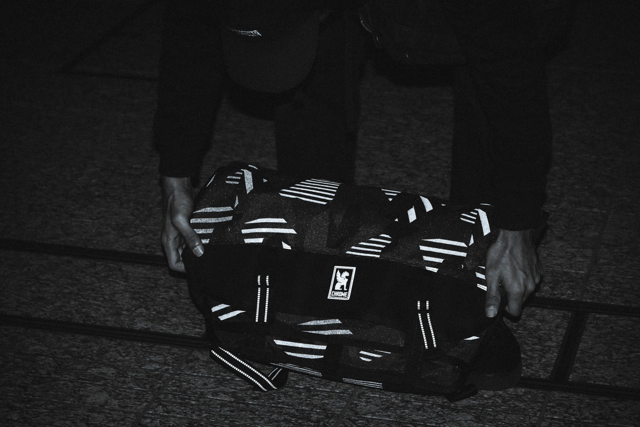 Chrome reflective swedish camo shown under light.