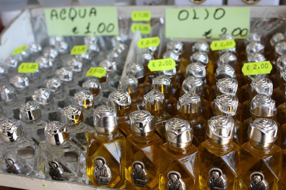 Holy water and miracle oil — some of the many Pio-related souvenirs for sale in San Giovanni Rotondo. | Photo by Andrea Palatnik.
