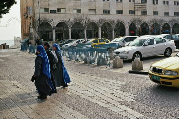 Two nuns cross the street in front of the Church of the Nativity in Bethlehem, where Pope Francis will make his first visit on Sunday, May 25. The Land/Evan Simko-Bednarski