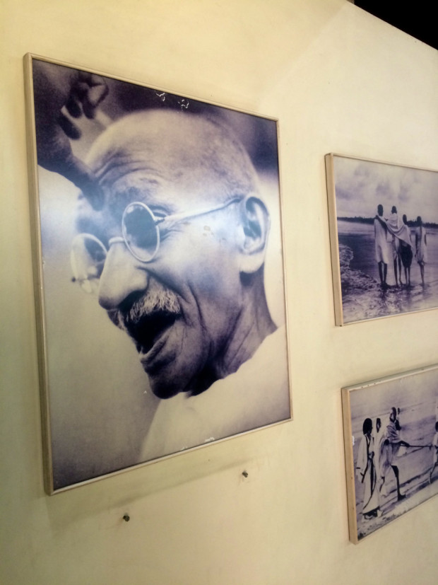 Photographs and prints line the walls of a walk-through museum of Gandhi’s life at the Smarak Sangrahalaya Ashram in Ahmedabad, India. Photo by Arielle Dreher.