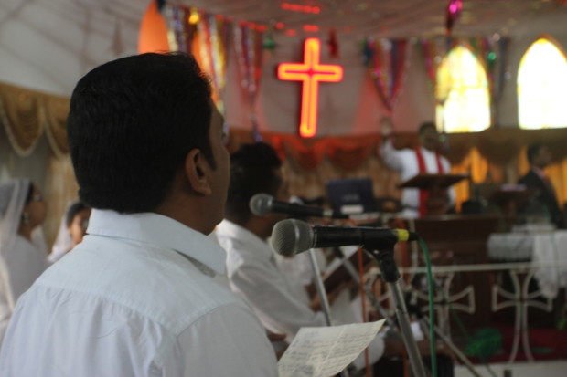 Devotees sing traditional Indian worship songs during Sunday service at the Church of North India, Ellis Bridge in Ahmedabad, India. Photo by Rachel Lowry.