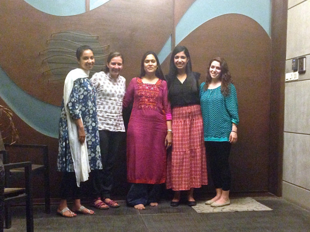 Liza Shah (center) welcomes the class’s teaching assistant, Aarti Virani (far left), and India Yatra reporters Arielle, Rashmi and Sara (left to right) to her home for a traditional Gujarati dinner. As a Jain, Shah served a meal resembled a typical Indian vegetarian dish, save for the use of onions, potatoes and garlic, ingredients that are prohibited in the Jain diet. Photo by Sara Aridi.