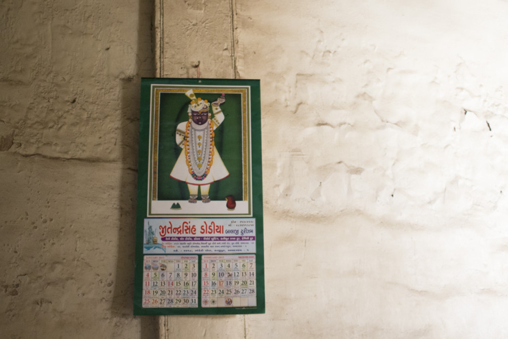 Cartoon-like deity is printed on a calendar.