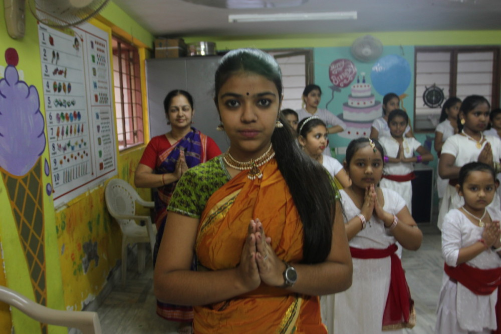 Hemant begins dance class with a verbal prayer. Many of her students come from different faith communities, like Jainism, Islam and Christianity. However, each identifies with the spirituality of the dances. For Hemant, dance is a form of prayer and an act of devotion to the gods of her Hindu faith. “The Veda said the shortest way to God is through dance,” she said. “It’s tradition. We begin with a prayer and ask for blessing from the guru, before we begin dancing.”