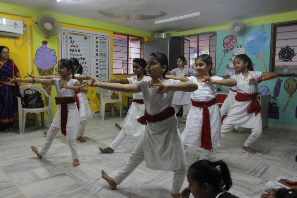 Young dancers lift their heel and bang it against the floor in a classic Indian pose. For many of Hemant’s students, the dance floor is a sanctuary, she said. It’s a place where girls can connect to a higher deity through their movement.