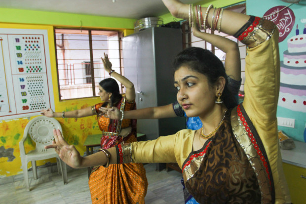The women hold the Shiva Pose as sticks are tapped by the instructor. Bharatanatyam dance requires intense concentration, said Bhairaviben Hemant. “When I’m dancing, I can’t do anything else.”