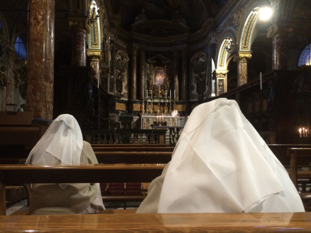 Nuns in prayer at the Basilica di Santa Maria in Via Lata in Rome, Italy. (Religio/Laura Brickman)