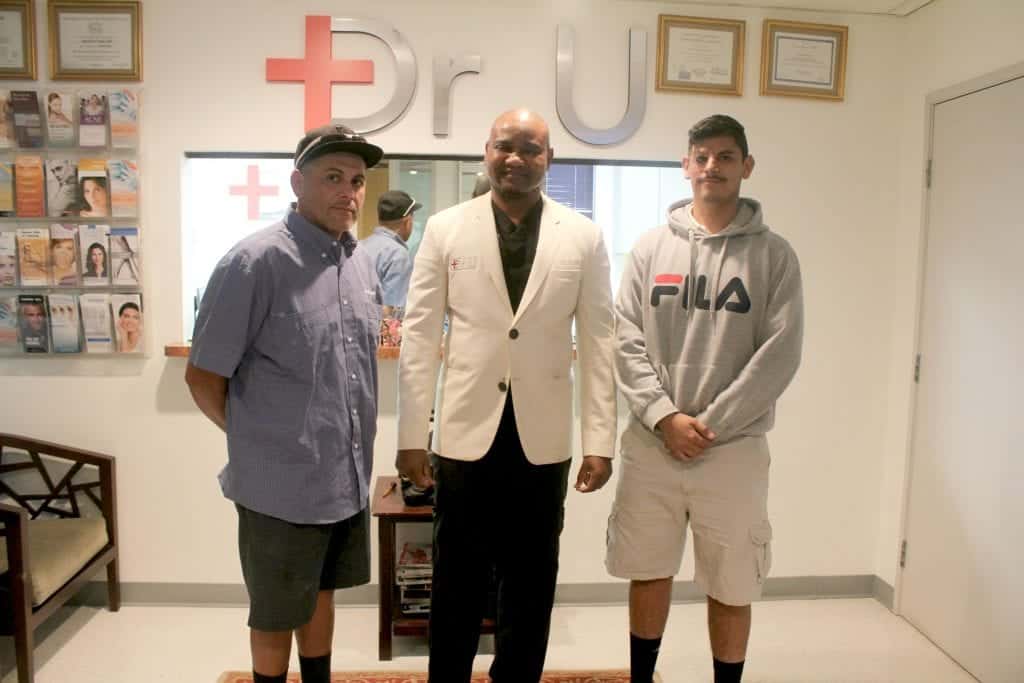 Dr. Umar with patient and his father