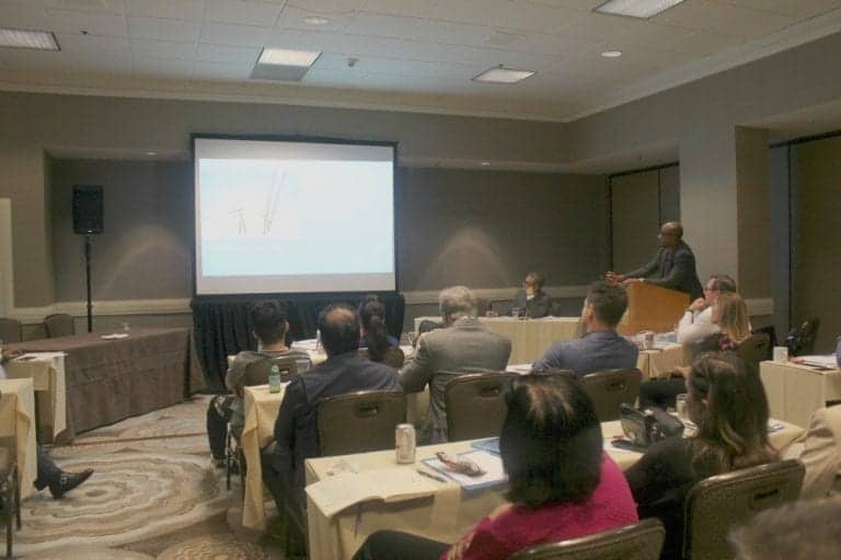 Dr. Umar giving a presentation at the ISHRS workshop on how his Dr.UGraft technology works to safely remove body hair to help patient cases that require a greater donor graft count