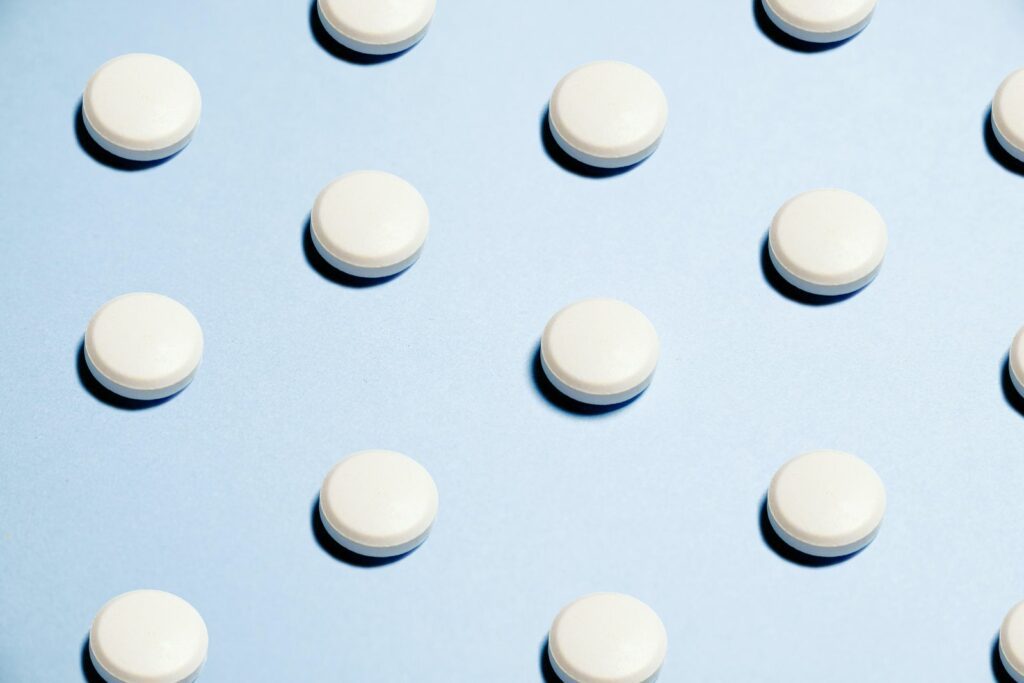 Image of contraceptive pills on a blue background.