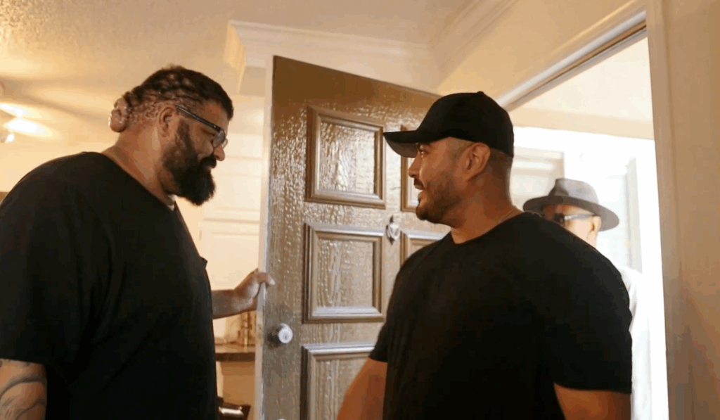 John opening the door for his cousin and uncle who came to visit him at his house.