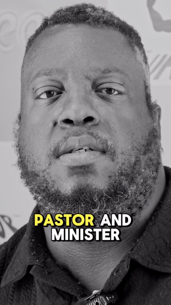 Black-and-white close-up of a bearded man speaking, with the words “PASTOR AND MINISTER” on screen.