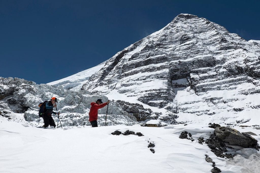 Trekking through fresh snow near Dhaulagiri Base Camp.