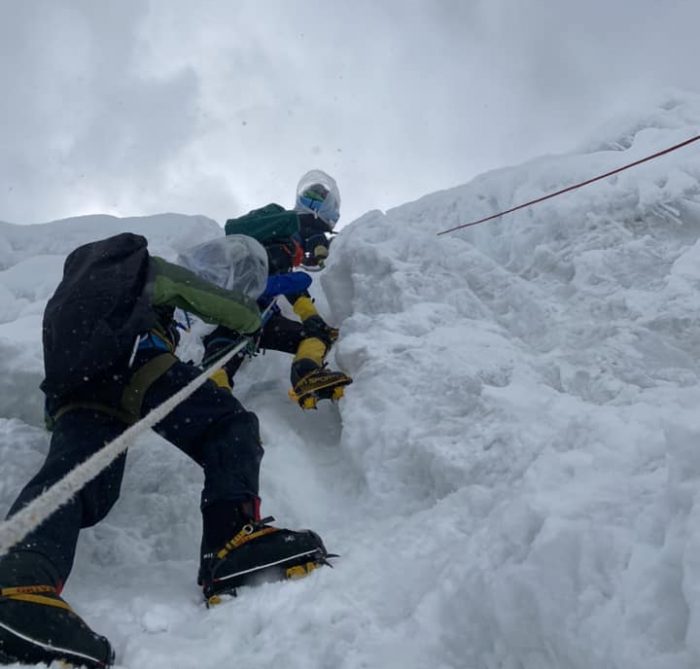 climbers go up fixed ropes