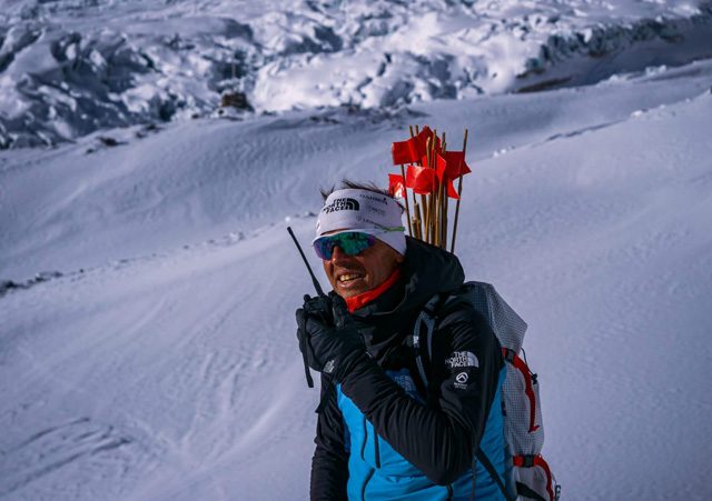 Moro trekking with a pack in the snowy Himalaya