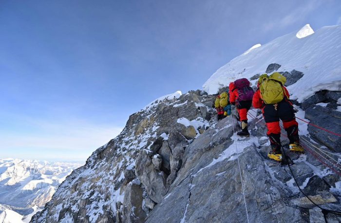 Climbers clipped to the fixed ropes on Everest.