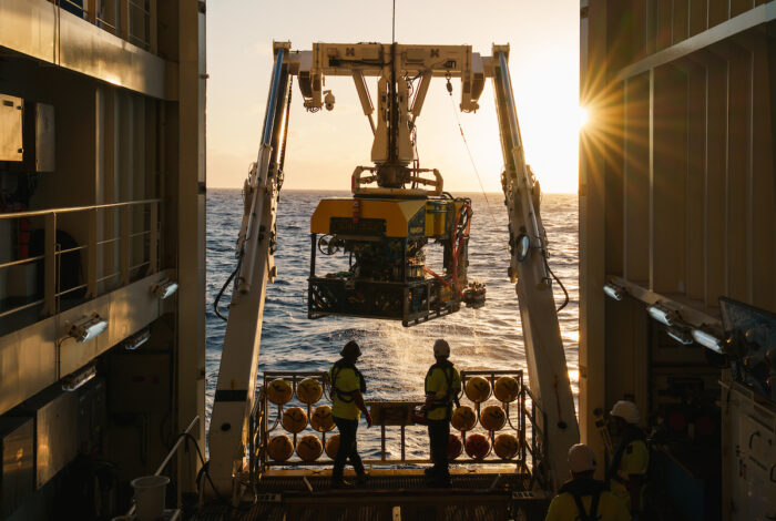 a crane lifting a large submersible