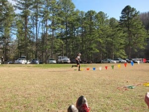 Meghan Hicks finishing one of the stages at 3 Days of Syllamo and an example of how using a back and front pack promotes a natural running form(Travis Liles photo credit)