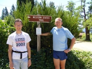 Paul Charteris - Kiwi Paul by WS 100 sign with Nick Ham 2006