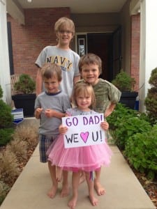 Andrews four children (left to right) Luke, Calvin, Birdie, and Axel cheer their dad on. Photo: Annabel Foery