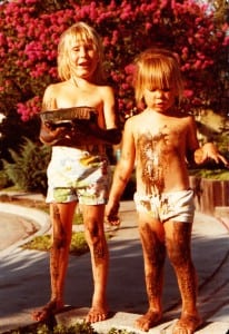 Pam Smith and her sister playing in mud