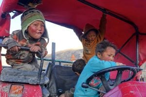 Kids on tractor - 2015 Mustang Trail Race